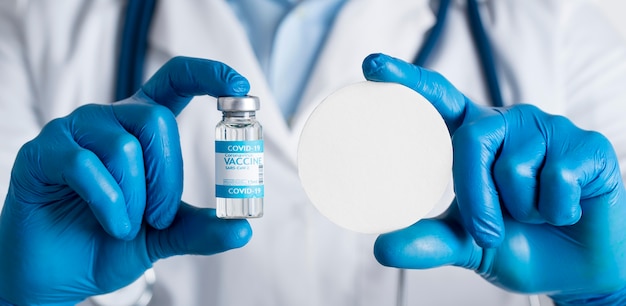 Photo doctor holding the coronavirus vaccine