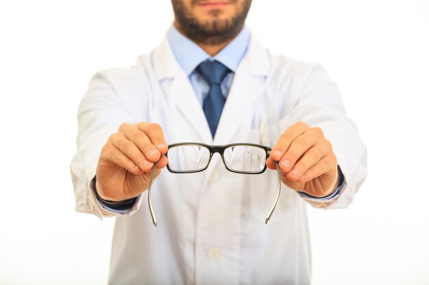 Doctor holding eye glasses