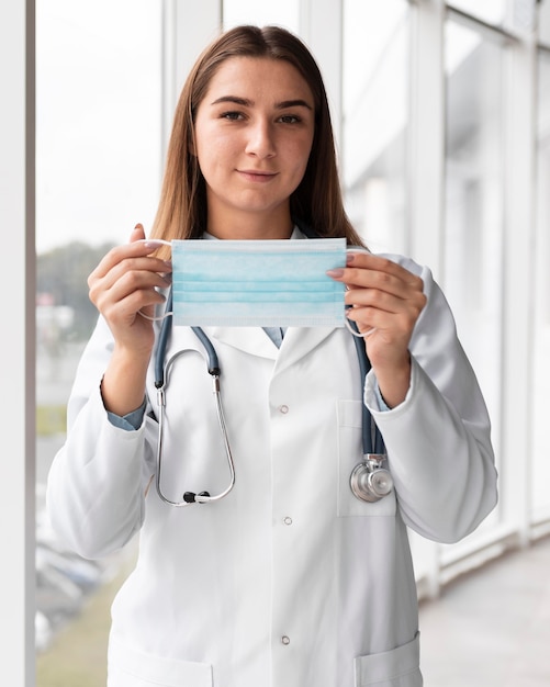 doctor holding face mask at the clinic