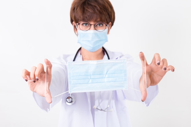 Doctor holding the mask.  Isolated on white background. Studio lighting. Concept for healthy and med