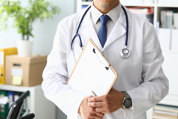 Doctor holding medical clipboard