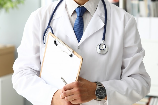 Doctor holding medical clipboard