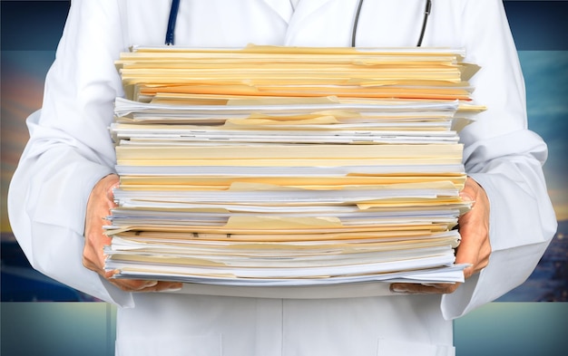 Doctor holding Medical Files