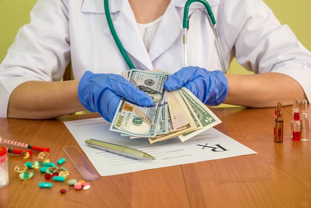 Doctor holding money in hands