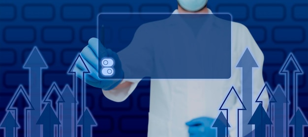 Doctor holding pen and pointing on digitally generated display with arrows moving up scientist