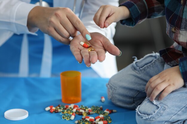 Doctor holding pills