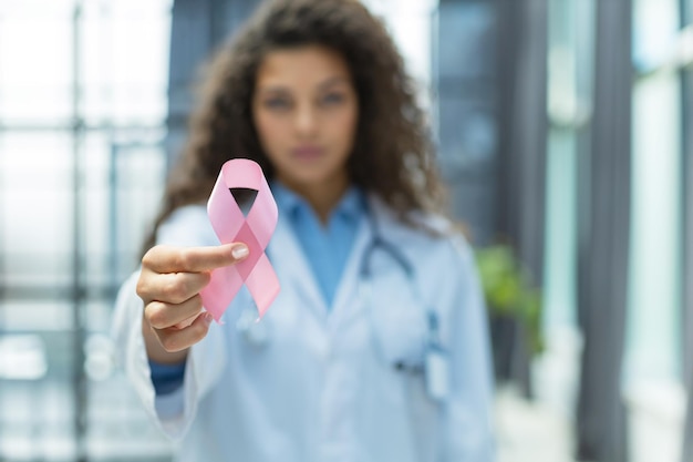 Doctor holding pink breast cancer awareness ribbon Medicine and healthcare concept women's health