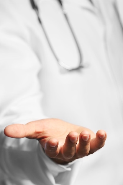 Photo doctor holding something closeup