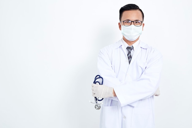 Doctor holding stethoscope on white background