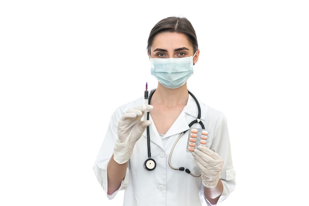 Doctor holding syringe isolated on white wall