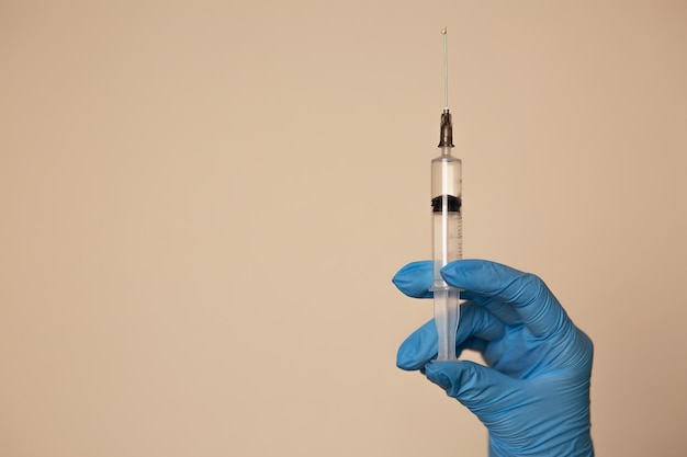 Doctor holding a syringe with a vaccine