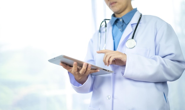 Doctor holding tablet healthcare and medicine concept doctor\
nurse