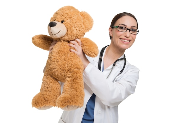 Doctor holding a teddy bear