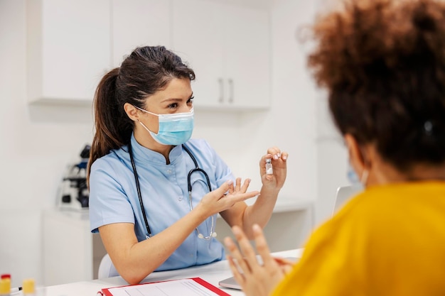 A doctor in hospital is sitting in doctor39s office and presenting new medicine