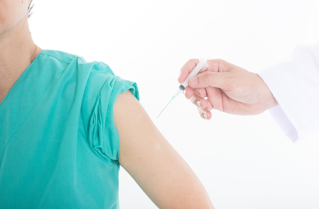 doctor inject immunization vaccine to patient arm