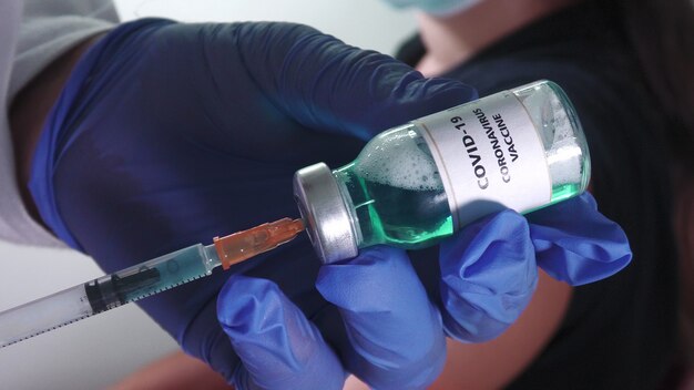 Doctor injects vaccine to fight the virus