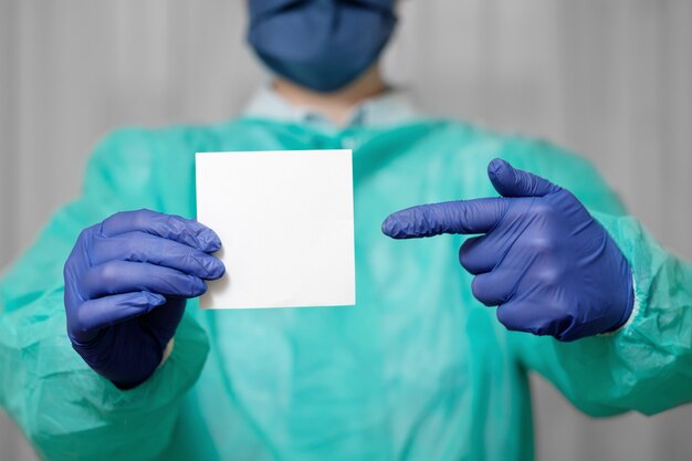 Doctor is holding a piece of paper for text, stay home, appeal of doctor  in coronavirus epidemic