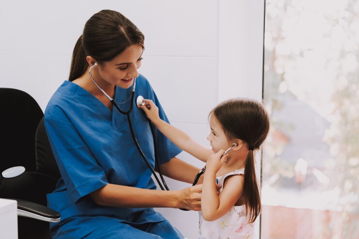 Photo doctor and kid listen each other by stethoscope.