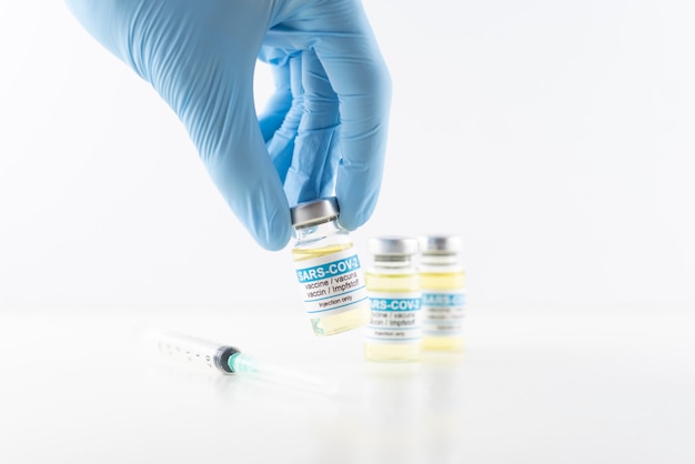 Doctor in laboratory taking a vaccine dose