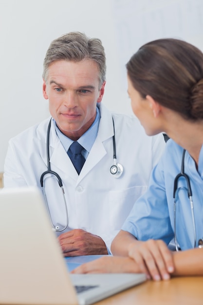 Doctor listening to a colleague