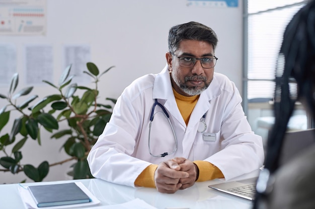 Doctor listening to patient