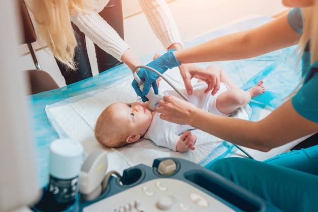 Photo doctor and little boy patient. ultrasound equipment. diagnostics. sonography.