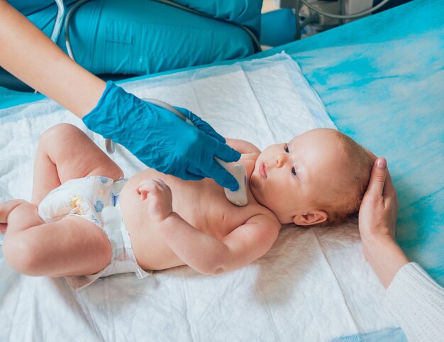 Doctor and little boy patient. Ultrasound equipment. Diagnostics. Sonography.