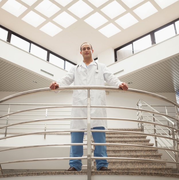 Doctor looking down from stairwell