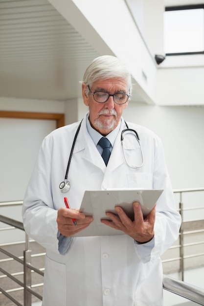 Doctor looking at patient files 