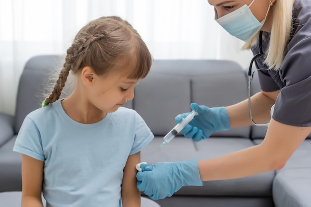 The doctor makes a child vaccination.