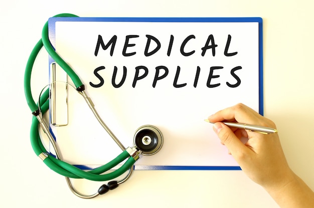 Doctor makes the inscription MEDICAL SUPPLIES