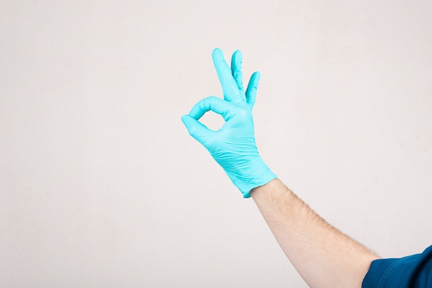 Doctor making "ok" sign with his hand