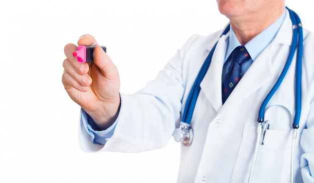 Doctor male writing something with marker on glass