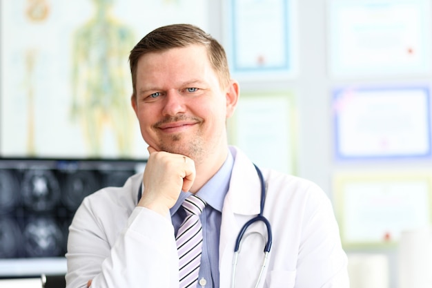 Doctor man smiling  in office