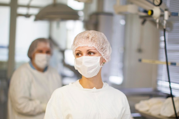 A doctor in a masked mask nurse in clothes