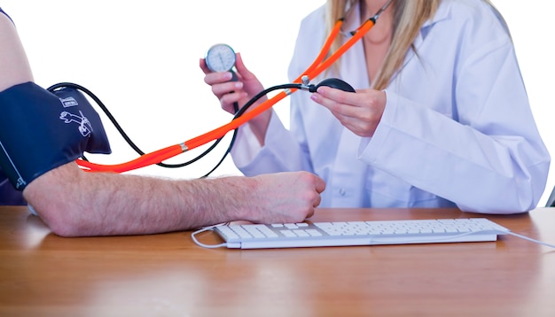 Doctor measuring blood pressure of a patient