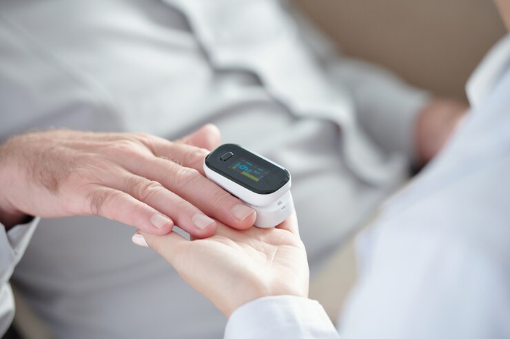 Photo doctor measuring oxygen saturation