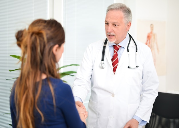 Doctor meeting a patient in his studio