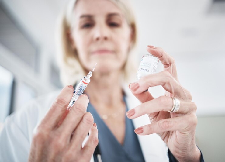 Photo doctor needle and covid 19 vaccine in vial for medication testing and safety in hospital wellness healthcare worker or medic with syringe for consulting injection and examination in clinic