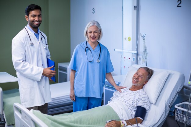 Doctor and nurse examining a patient