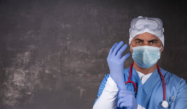 Doctor or nurse wearing protective mask and latex gloves