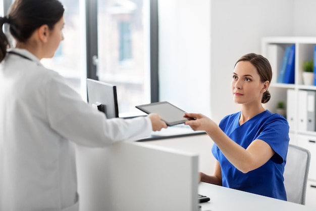 doctor and nurse with tablet computer at hospital