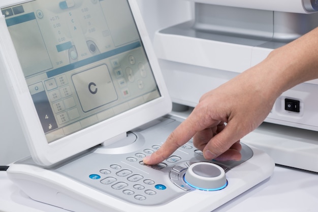 Doctor oculist at work. diagnostic ophthalmologic equipment. medicine concept