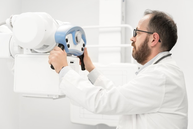 Doctor operating medical equipment