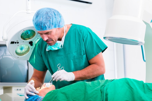 Doctor in operation in operating room