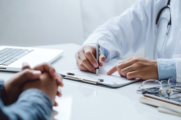 Photo doctor and patient are discussing consultation about symptom problem diagnosis of disease and treatment method.medicine and health care concept.