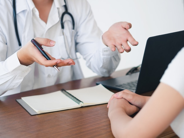 Doctor and Patient are talking in the hospital. Health care and Medical Concept.