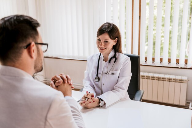 Doctor and patient discussing at doctor's office