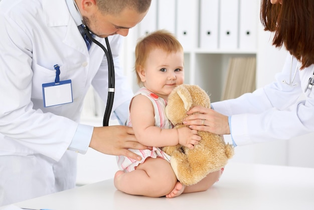 Doctor and patient Happy cute baby at health exam Medicine and health care concept