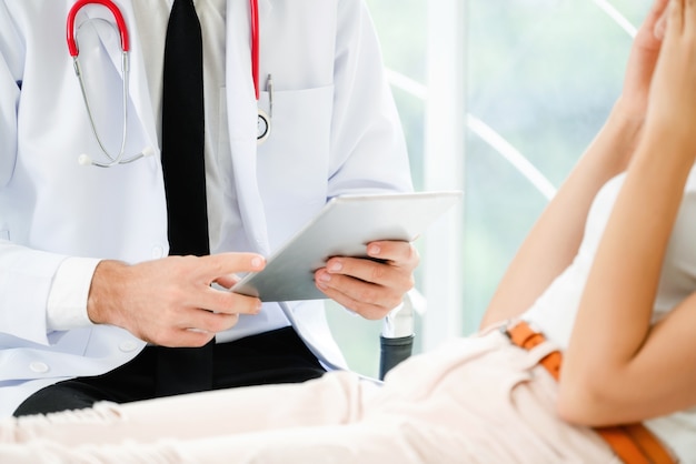 Doctor and patient in hospital room. Medical and healthcare service.